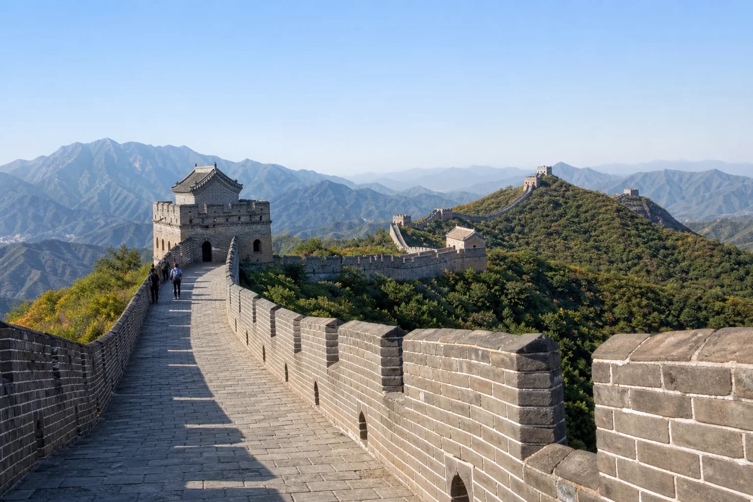 Restored Great Wall section crossing mountain ridges near Beijing